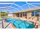 Refreshing kidney-shaped pool with patio at 15912 Melport Cir, Port Charlotte, FL 33981
