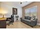 Home office with desk, chair, and comfortable couch at 15912 Melport Cir, Port Charlotte, FL 33981
