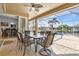 Covered patio with seating area overlooking the pool and canal at 15912 Melport Cir, Port Charlotte, FL 33981