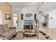 Relaxing living room with comfortable seating and access to other rooms at 15912 Melport Cir, Port Charlotte, FL 33981