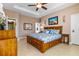 Spacious main bedroom with king-size bed and private access at 15912 Melport Cir, Port Charlotte, FL 33981