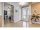 Bright and airy entryway with tiled floors and glass door at 15912 Melport Cir, Port Charlotte, FL 33981