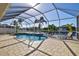 Inviting screened pool and spa with canal views at 15912 Melport Cir, Port Charlotte, FL 33981