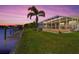 Waterfront home with private dock and beautiful sunset at 15912 Melport Cir, Port Charlotte, FL 33981