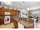Modern kitchen with granite countertops and ample wood cabinetry at 15912 Melport Cir, Port Charlotte, FL 33981
