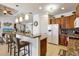 Modern kitchen with granite countertops, breakfast bar and stainless steel appliances at 15912 Melport Cir, Port Charlotte, FL 33981