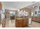 Open kitchen with granite island, stainless steel appliances and breakfast bar at 15912 Melport Cir, Port Charlotte, FL 33981