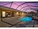 Relaxing pool area with covered patio at 15912 Melport Cir, Port Charlotte, FL 33981