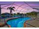 Beautiful pool with screened enclosure and water view at 15912 Melport Cir, Port Charlotte, FL 33981
