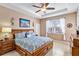 Large main bedroom with king-size bed and wood dresser at 15912 Melport Cir, Port Charlotte, FL 33981