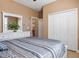 Main bedroom with a queen bed, dresser, and large closet at 15912 Melport Cir, Port Charlotte, FL 33981