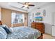 Main bedroom with king bed, TV, and access to the patio at 15912 Melport Cir, Port Charlotte, FL 33981