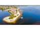 Beautiful beachfront property with sailboat in the bay at 15912 Melport Cir, Port Charlotte, FL 33981