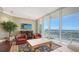 Elegant living room with hardwood floors, comfortable seating, and water views at 1233 N Gulfstream Ave # 1001, Sarasota, FL 34236