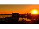 Stunning sunset over a waterfront community with boats and high-rise buildings at 1233 N Gulfstream Ave # 1001, Sarasota, FL 34236