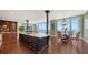Open concept kitchen with large island, granite counters and breakfast area at 1233 N Gulfstream Ave # 1001, Sarasota, FL 34236