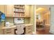 Home office with built-in shelving and granite countertop at 1233 N Gulfstream Ave # 1001, Sarasota, FL 34236
