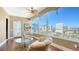 Relaxing sunroom with city views and comfortable seating at 1233 N Gulfstream Ave # 1001, Sarasota, FL 34236