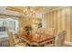 Elegant dining room with hardwood floors and chandelier at 1233 N Gulfstream Ave # 1001, Sarasota, FL 34236