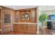 Custom wet bar with wine storage and granite countertop at 1233 N Gulfstream Ave # 1001, Sarasota, FL 34236