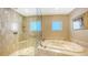 Spa-like bathroom with a large soaking tub and a separate shower at 1233 N Gulfstream Ave # 1001, Sarasota, FL 34236