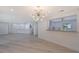 Spacious dining area with open concept to kitchen, and hardwood floors at 6101 34Th W St # 15B, Bradenton, FL 34210