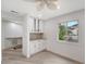 Bright breakfast nook with white cabinets, granite countertop, and built-in shelving at 6101 34Th W St # 15B, Bradenton, FL 34210