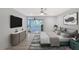 Main bedroom with large TV, updated flooring and access to patio at 6101 34Th W St # 15B, Bradenton, FL 34210