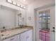 Bathroom with granite countertop, updated vanity and private access to patio at 6101 34Th W St # 15B, Bradenton, FL 34210