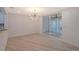 Bright dining room with modern chandelier and access to a screened balcony at 6101 34Th W St # 15B, Bradenton, FL 34210