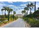 Lush landscaping lines the driveway leading to the property entrance at 6101 34Th W St # 15B, Bradenton, FL 34210