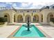 Elegant courtyard with fountain, creating a tranquil outdoor space at 6101 34Th W St # 15B, Bradenton, FL 34210