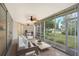 Relaxing screened patio with outdoor furniture and serene garden views at 6101 34Th W St # 15B, Bradenton, FL 34210