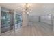 Light and airy dining room, features a chandelier and sliding doors to a patio at 6101 34Th W St # 15B, Bradenton, FL 34210