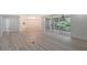 Luminous living room, featuring wood-look tile and access to a patio at 6101 34Th W St # 15B, Bradenton, FL 34210