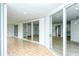 Bright screened patio with sliding glass doors leading to the outdoors at 6101 34Th W St # 15B, Bradenton, FL 34210