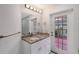 Bathroom features granite countertop, updated vanity and private access to patio at 6101 34Th W St # 15B, Bradenton, FL 34210