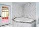 Bathroom with corner soaking tub and private access to patio at 6101 34Th W St # 15B, Bradenton, FL 34210