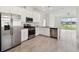 Modern kitchen featuring stainless steel appliances and white cabinetry at 11722 Bluebird Pl, Bradenton, FL 34211