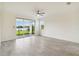 Living room with tile floors and access to backyard patio at 11722 Bluebird Pl, Bradenton, FL 34211