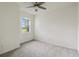 Spacious bedroom with neutral carpeting and ceiling fan at 11722 Bluebird Pl, Bradenton, FL 34211