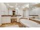 Spa-like bathroom featuring a corner soaking tub and double vanity with marble countertops at 393 N Point Rd # 801, Osprey, FL 34229