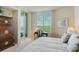 Bright bedroom with water views and a writing desk at 393 N Point Rd # 801, Osprey, FL 34229