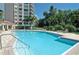 Inviting community pool with ample deck space for lounging at 393 N Point Rd # 801, Osprey, FL 34229