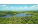 Stunning aerial view of lush landscape and waterways at 393 N Point Rd # 801, Osprey, FL 34229