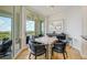 Bright breakfast nook with water views and seating for four at 393 N Point Rd # 801, Osprey, FL 34229