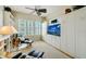 Multi-functional den with comfortable seating, built-in shelving and a murphy bed at 393 N Point Rd # 801, Osprey, FL 34229