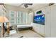 Cozy den with comfortable seating, built-in shelving, and a murphy bed at 393 N Point Rd # 801, Osprey, FL 34229