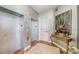 Elegant hallway with elevator access and artwork at 393 N Point Rd # 801, Osprey, FL 34229
