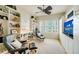Relaxing den with comfortable seating, built-in shelving, and a murphy bed at 393 N Point Rd # 801, Osprey, FL 34229